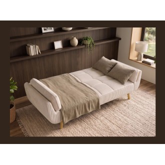 Canapé 3 places NEVISI côtelé beige en mode lit avec des accessoires