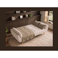 Canapé 3 places NEVISI côtelé beige en mode lit avec des accessoires