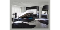 Lit double 180 cm avec option coffre LINA. Coloris noir et blanc brillant avec une finition en simili cuir. Sommier inclus