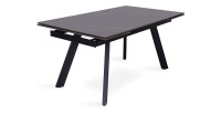 Uitschuifbare eettafel voor 10 personen met een zwart stenen blad uit de LAROS collectie. Structuur van metaal.