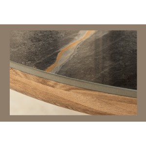 Zoom sur le côté du plateau de la table LUMEA ovale noir et bois