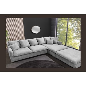 Canapé d'angle et pouf KALIA en tissu bouclette gris mis en situation