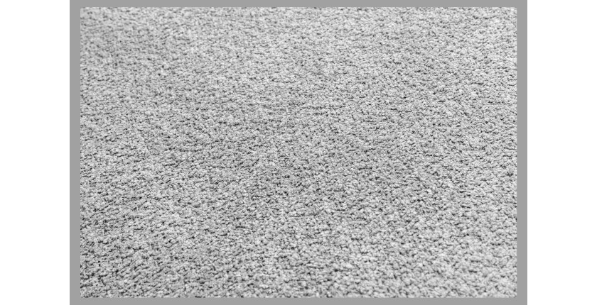 Zoom sur la texture du canapé d'angle et du pouf KALIA en tissu bouclette gris