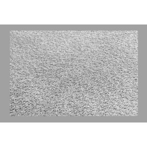 Zoom sur la texture du canapé d'angle et du pouf KALIA en tissu bouclette gris