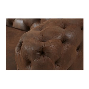 Zoom sur l'accoudoir du canapé droit dans la configuration du canapé droit + pouf VELENA marron