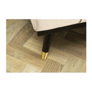 Zoom sur l'un des pieds du canapé convertible FILI blanc