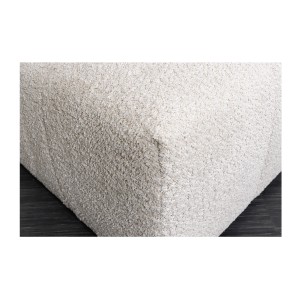 Zoom sur la tranche du pouf dans la configuration canapé et pouf IMPERIA blanc champagne