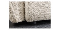 Zoom sur le bas du canapé dans la configuration canapé et pouf IMPERIA blanc champagne