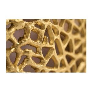 Zoom sur les motifs ajourés de la table basse ronde 75cm dorée METRIX