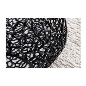 Zoom sur les motifs ajourés de la table basse ronde avec niche centrale noire METRIX