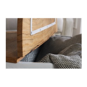 Zoom sur le plateau ouvert de la table basse ronde TRIANE 60cm blanche et bois