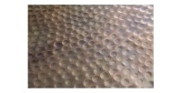 Zoom sur la texture de la table basse TRIANE cuivre ronde 80cm