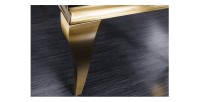 Zoom sur le pied de la table basse VELENA plateau noir et pieds or