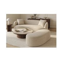 Pouf NYJY champagne vu avec le canapé de la même collection