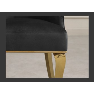 Zoom sur l'assise de la chaise VELENA en velours noir et pieds dorés